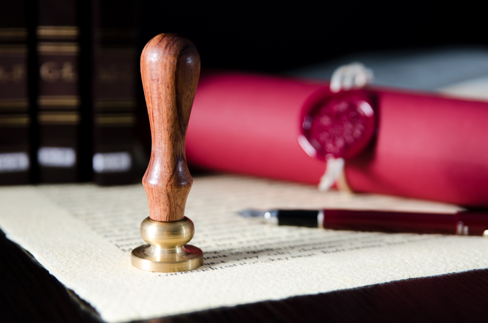 Law, Attorney, Notary Public Stamp and Pen on Desk